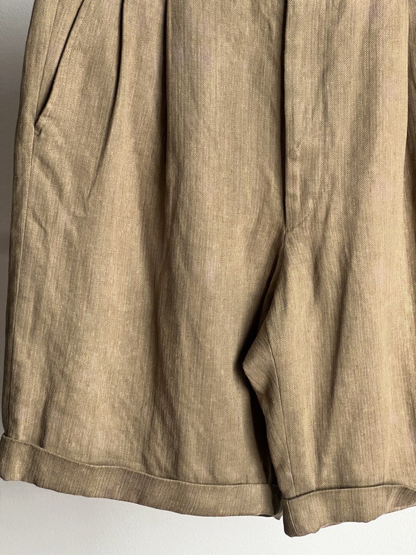 Hermes Pleated Linen Blend Shorts Tan (Category: Luxury Apparel) located in Quezon City. Submitted by raccoonfur (Listing ID 1464414768, Image 2). Description: Hermes tailored short pants in 100% linen. Has some stains and fadings all around. Not that conspicuous when worn, somehow blends through. Back seam stitch lines. Great condition nonetheless. Has that old money nonchalance. Flat measurements: Waist 42cm/16.5in Length 53.25cm/21in Crotch 36
