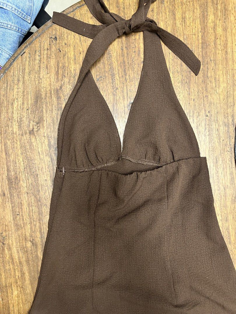 H&M Brown Halter Neck Dress (Category: Dresses) located in Manila. Submitted by tshopph (Listing ID 1464419837, Image 3). Description: H&M DIVIDED Chocolate Brown Halter Neck Mini Dress Upgrade your night-out or casual wardrobe with this chic halter mini dress. Features a deep V-neck, adjustable self-tie neck straps, textured fabric, and a side zipper for a flattering silhouette. Perfect for dinners, dates, bar nights, or warm-weather outings ✨ S