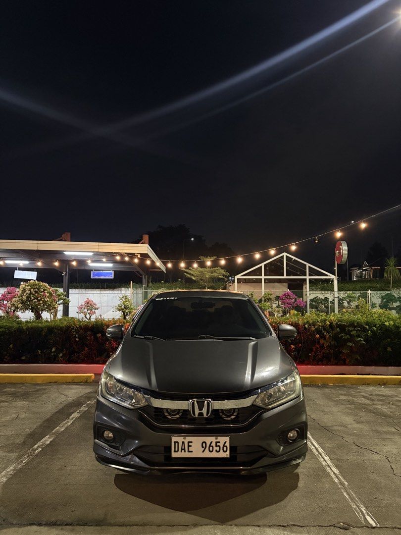 Honda City E Auto (Category: Used Cars) located in Binan City. Submitted by jannelczablan (Listing ID 1464364709, Image 2). Description: FOR SALE‼️ Honda City 1.5 E CVT -Model: 2018 -Color: Modern Steel -Mileage: 82,449km -Fuel Type: Gasoline -Ending Plate No. “6” -2 Original Keys -Dashcam Installed (No SD card insert) -Upgraded LED Tail Lights -Upgraded Fog Light Tri Color -Upgraded Muffler HKS -Bosch Horn Installed -17’s Rota RPF1 Mags -Stock H