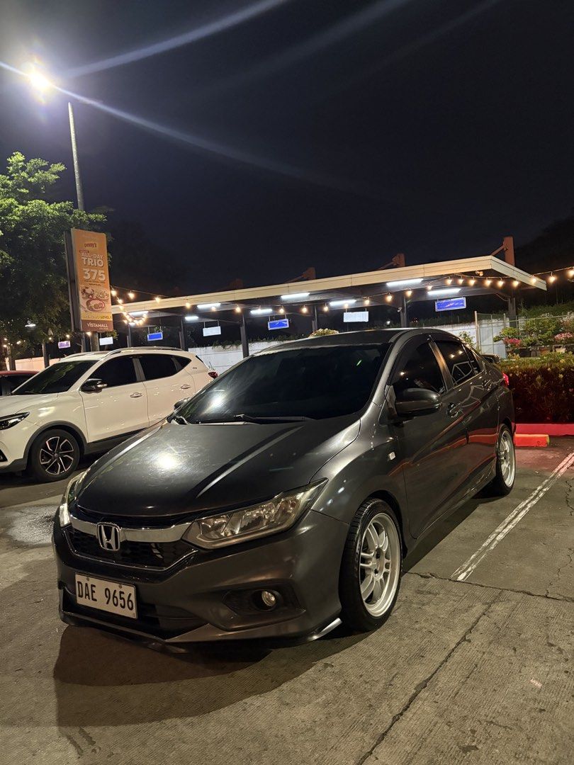 Honda City E Auto (Category: Used Cars) located in Binan City. Submitted by jannelczablan (Listing ID 1464364709, Image 3). Description: FOR SALE‼️ Honda City 1.5 E CVT -Model: 2018 -Color: Modern Steel -Mileage: 82,449km -Fuel Type: Gasoline -Ending Plate No. “6” -2 Original Keys -Dashcam Installed (No SD card insert) -Upgraded LED Tail Lights -Upgraded Fog Light Tri Color -Upgraded Muffler HKS -Bosch Horn Installed -17’s Rota RPF1 Mags -Stock H