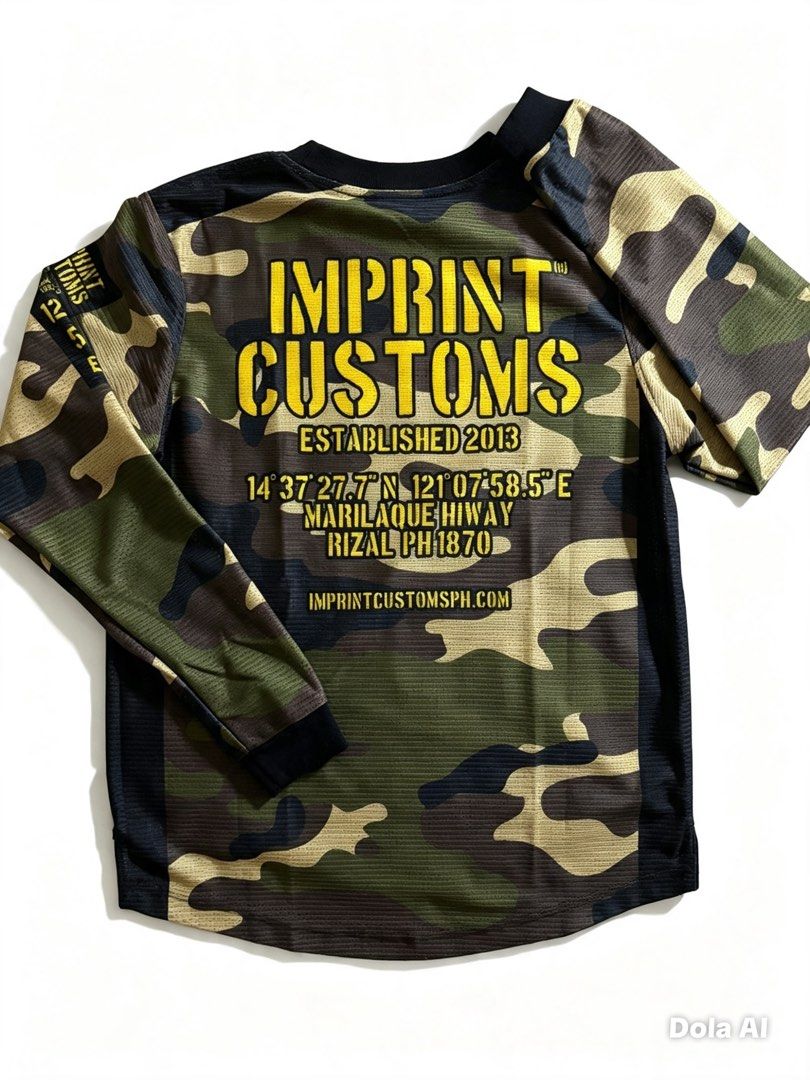Imprint Customs Camo Long Sleeve Shirt (Category: Tshirts & Polo Shirts ) located in Caloocan City. Submitted by clang17. (Listing ID 1464385592, Image 1). Description: - Long sleeve shirt from Imprint Customs - Features a camouflage pattern with yellow text - Established in 2013 - Located in Marilao -way, Rizal - Visit imprintcustomsph.com for more info - Ideal for casual wear or outdoor activities.