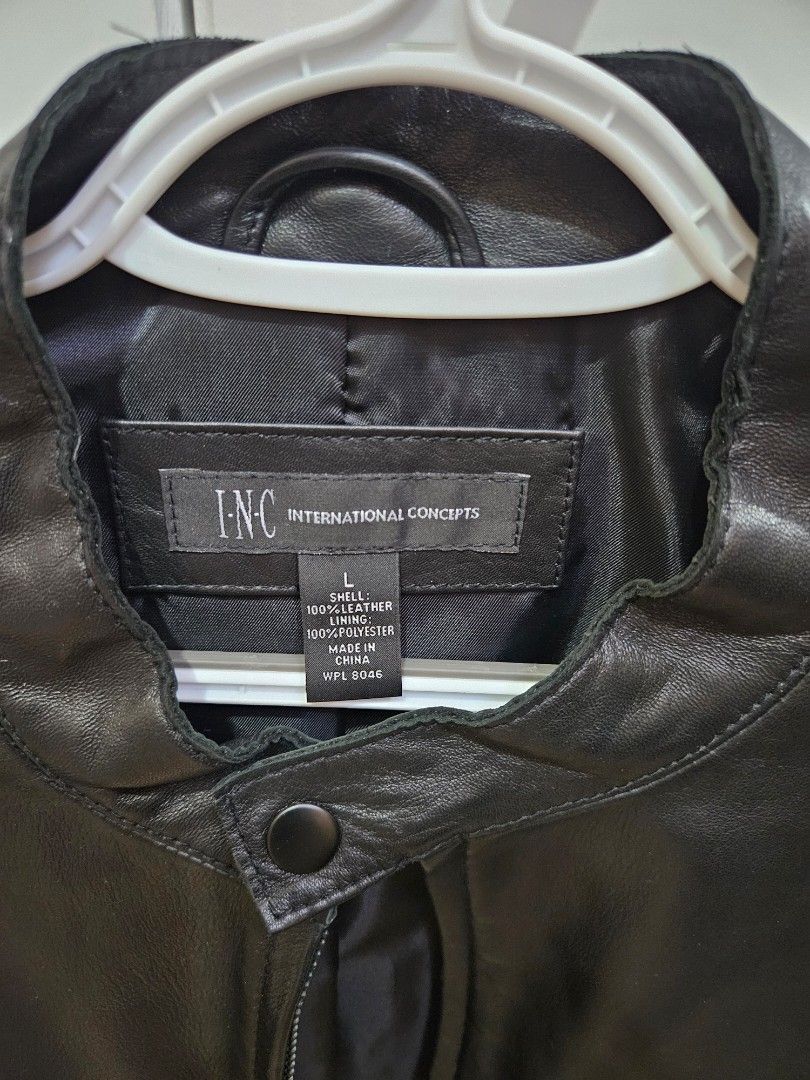 INC International Concepts Black Leather Jacket Size L (Category: Coats, Jackets and Outerwear) located in Las Pinas. Submitted by bellaprima888 (Listing ID 1464359887, Image 2). Description: - Genuine black leather jacket from INC International Concepts - Almost new - Polyester lining - Zip-up front closure - Multiple zip pockets for secure storage - Snap closure on the collar - Classic, versatile style for layering or standalone wear.