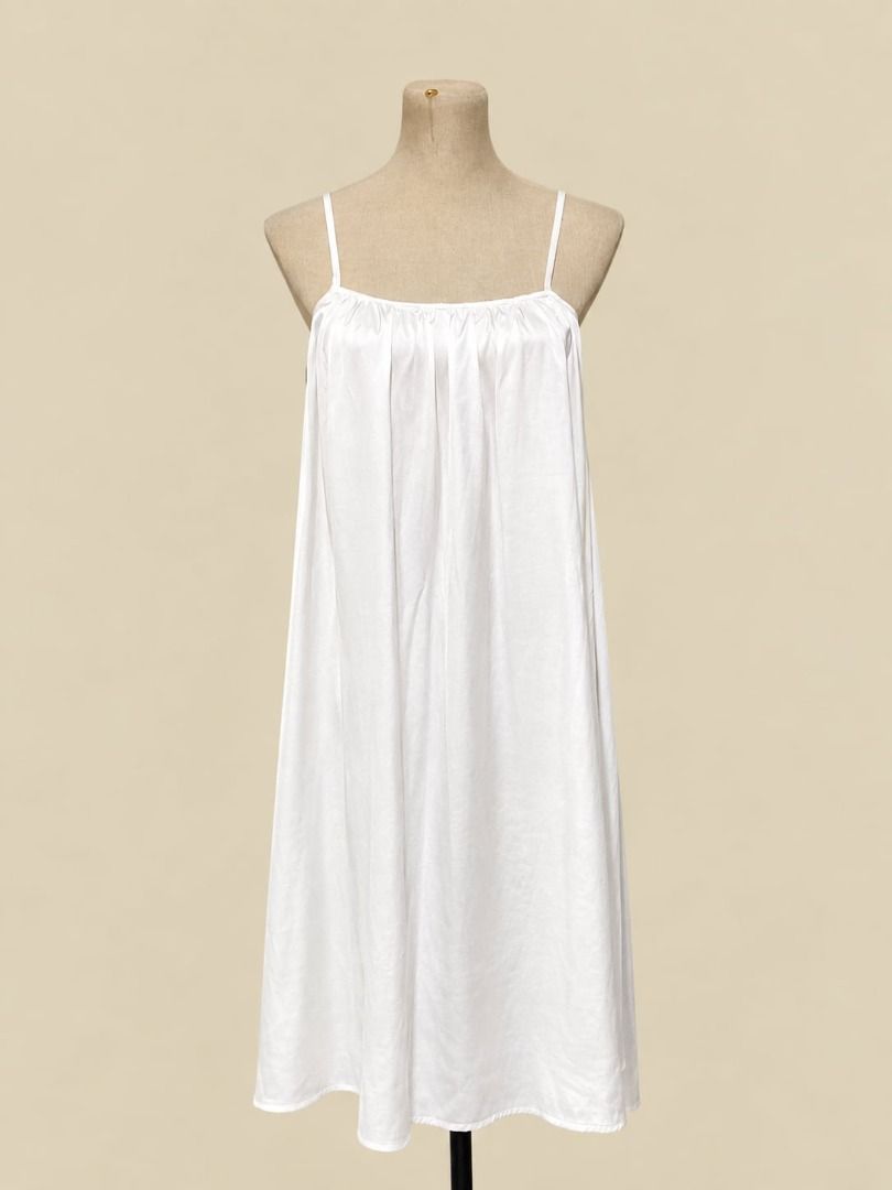 Ivory Satin Cami Dress (Category: Dresses) located in Angeles City. Submitted by thebeehivecloset (Listing ID 1464489586, Image 1). Description: legant ivory satin cami dress with delicate tie straps and a soft, flowy silhouette. Lightweight, feminine, and perfect for effortless everyday or date-night looks..