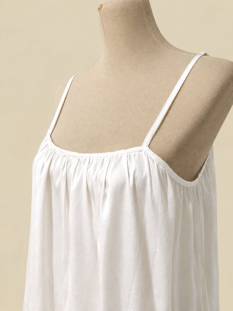 Ivory Satin Cami Dress (Category: Dresses) located in Angeles City. Submitted by thebeehivecloset (Listing ID 1464489586, Image 3). Description: legant ivory satin cami dress with delicate tie straps and a soft, flowy silhouette. Lightweight, feminine, and perfect for effortless everyday or date-night looks..
