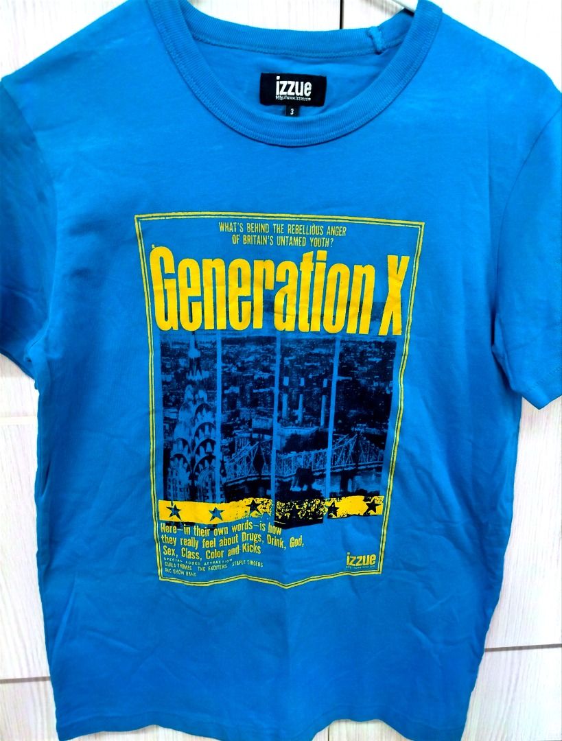Izzue Generation X Graphic T-Shirt (Category: Others Tops) located in Caloocan City. Submitted by safebear_4bdc70 (Listing ID 1464468796, Image 2). Description: Cool blue Izzue tee, size 2, with a Generation X graphic print featuring a city skyline and bold yellow text. Perfect for 90s style enthusiasts or Gen X fans..