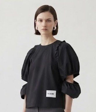 Jil Sander+ Black Puff Sleeve Cut-Out Top (Category: Blouses) located in Donsol. Submitted by saksthriftavenuebyluckymaria8 (Listing ID 1463711722, Image 1). Description: - Black Jil Sander+ top - Dramatic puff sleeves with cut-out details - Ruffled trim along shoulder seams - Classic crew neck - Convenient back zipper closure - Small Jil Sander+ logo tag on front hem - Made in Italy Jil sander cut out sleeves black top sz M chest 21in armhole 13