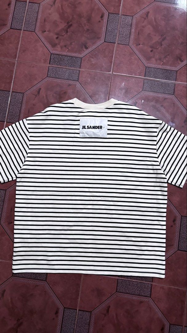 Jil Sander Striped T-Shirt (Category: Coats, Jackets and Outerwear) located in Manila. Submitted by tatskybagyu_1026 (Listing ID 1464477472, Image 1). Description: - Classic Jil Sander striped t-shirt - Black and white horizontal stripes - Features Jil Sander+ logo patch on chest - Comfortable and stylish for everyday wear - Perfect wardrobe staple.
