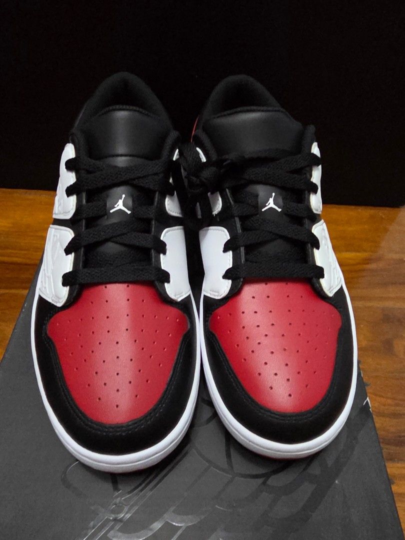 Jordan Nu Retro 1 Low Varsity Red/Black-White (Category: Sneakers) located in Manila. Submitted by silienat (Listing ID 1464525443, Image 3). Description: - Jordan Nu Retro 1 Low - Colorway: Varsity Red, Black, and White - Size: US9 - Includes original box - Ideal for Jordan enthusiasts and collectors.