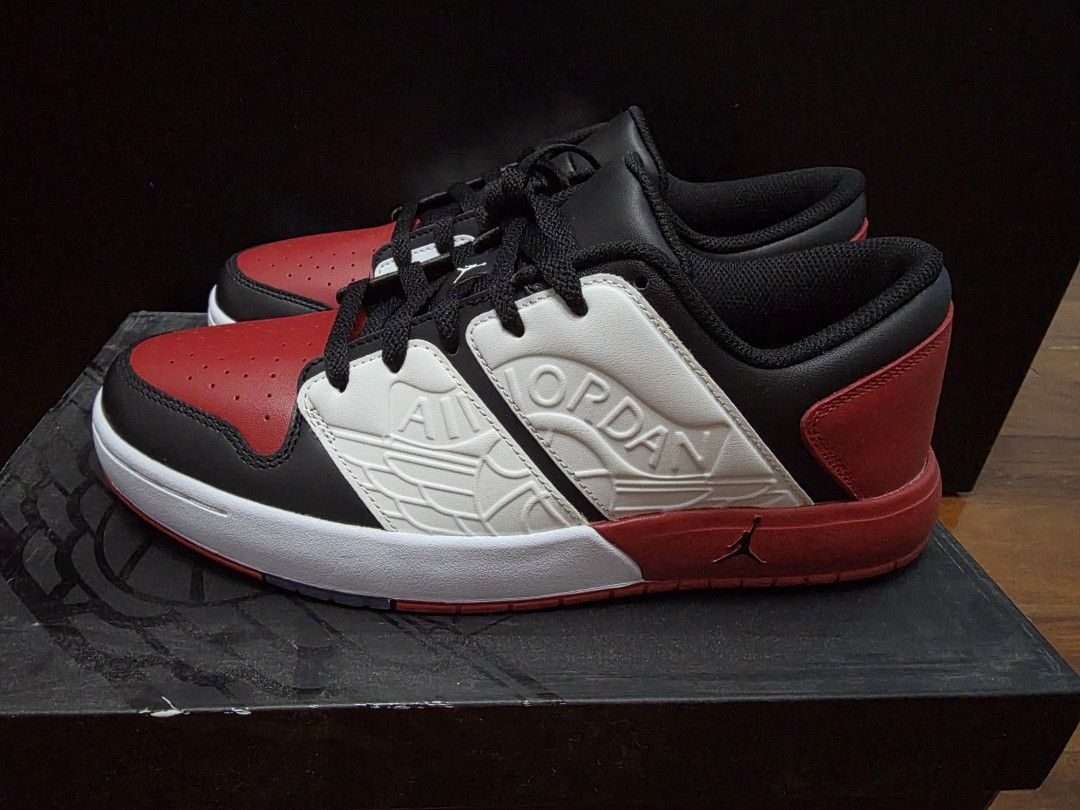 Jordan Nu Retro 1 Low Varsity Red/Black-White (Category: Sneakers) located in Manila. Submitted by silienat (Listing ID 1464525443, Image 1). Description: - Jordan Nu Retro 1 Low - Colorway: Varsity Red, Black, and White - Size: US9 - Includes original box - Ideal for Jordan enthusiasts and collectors.