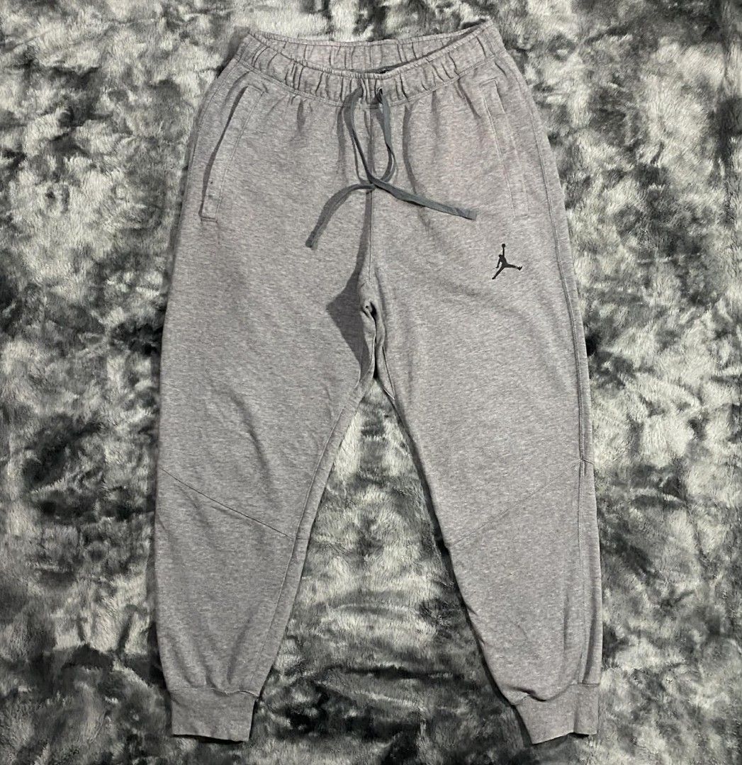 Jordan Sweatpants Grey Joggers Size M (Category: Joggers) located in Sorsogon. Submitted by johnmichae69459 (Listing ID 1464499641, Image 1). Description: - Grey Jordan sweatpants - Jogger style with elastic waistband and drawstring - 30 to 34 waistline - 38 lenght - Iconic Jumpman logo on left leg - Zippered pockets for secure storage - Comfortable cotton blend fabric - Perfect for everyday wear.