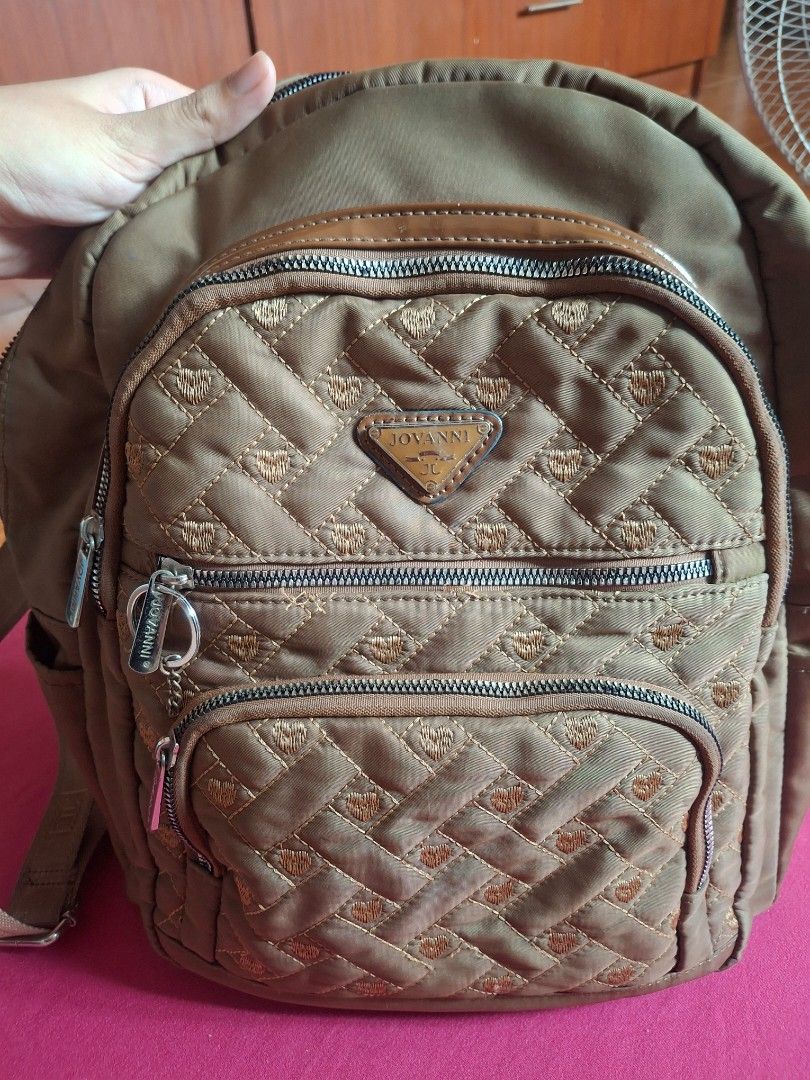 JOVANNI Heart Quilted Backpack (Category: Cross-body Bags) located in Plaridel. Submitted by niannyyy (Listing ID 1464395614, Image 3). Description: - Brand: JOVANNI - Color: Brown - Ideal For: Everyday use - Condition: Please check photos for details - Main zipper needs repair besides that everything is in pristine condition..