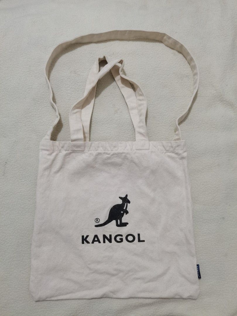 Kangol Eco-Friendly 2-Way Canvas Tote Bag (Category: Tote Bags) located in Santa Cruz. Submitted by oddpenguin-4575 (Listing ID 1464539544, Image 2). Description: 📌.....P L E A S E R E A D..... 📌measurement:L-14" /W-14.5" 📌color-9/10 📌Brand:Kangol 📌issue:sign of usage 📌This is an authentic Kangol Eco-Friendly 2-Way Canvas Tote Bag. It is designed with dual carrying options, featuring both standard handheld top handles and a longer shoulder 