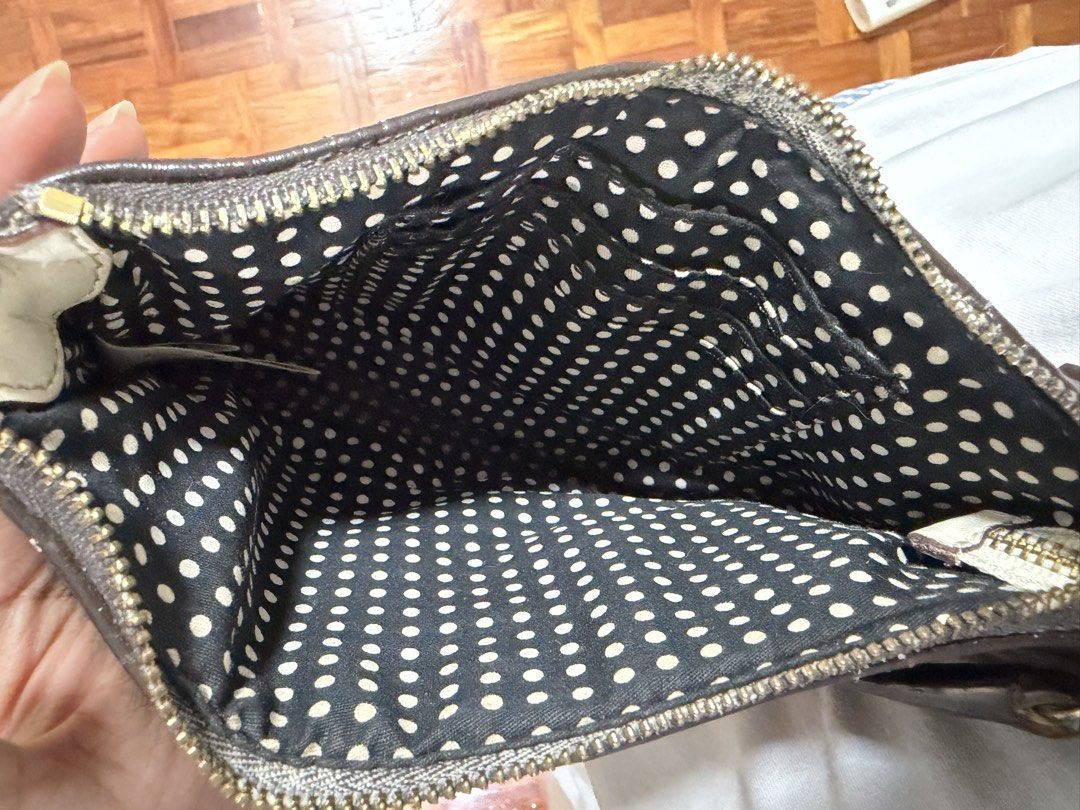 Kate Spade - Brown Quilted Shoulder Bag (Category: Shoulder Bags) located in Paranaque City. Submitted by ferrewr (Listing ID 1464353252, Image 3). Description: - Cute brown shoulder bag (used to be white - leather painted it brown) - All-over quilted pattern - Zipper closure - Small gold logo plate on the front - Perfect size for essentials - Easy to carry - 100% authentic / original .