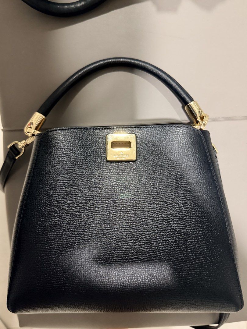 Kate Spade Phoebe Small Black Leather Top Handle Bag (Category: Tote Bags) located in Paranaque City. Submitted by silverforest.13 (Listing ID 1464387279, Image 1). Description: - Genuine black leather Kate Spade top handle bag - Elegant gold hardware details - Versatile: can be carried by the top handle or with the detachable shoulder strap - Secure magnetic snap closure - Interior pockets for organization - Pristine condition, clean inside and 