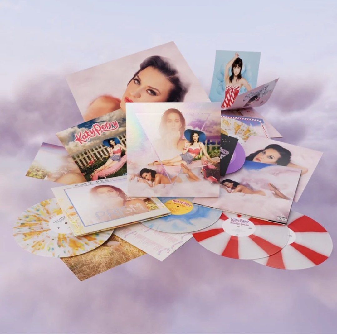 Katy Perry Prism Vinyl Records Collection (Category: Vinyls) located in Santa Ana. Submitted by keepmelogin (Listing ID 1464403841, Image 1). Description: - Katy Perry Prism Album on Vinyl - Features multiple colored vinyl records - Some records have unique splatter designs - Includes red and white striped vinyl - Comes with album cover art and promotional images.
