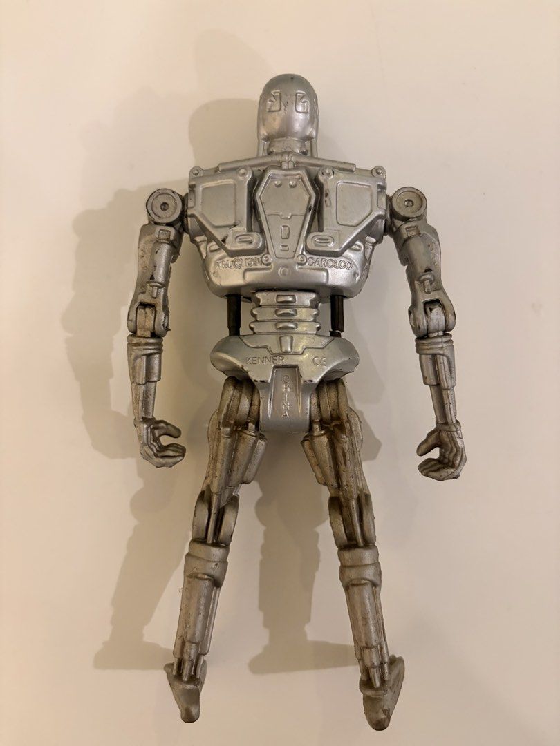 Kenner Terminator T-800 Action Figure (Category: Action & Battle Toys) located in Santa Rosa. Submitted by serf60762 (Listing ID 1464506026, Image 3). Description: Selling Vintage (1991) Terminator T-800 action figure (Terminator 2: Judgement Day) by Kenner for PhP 600 - From the iconic Terminator 2 movie - Features a highly detailed metallic finish - Glowing eyes when light hits top of head - Fully articulated joints for dynamic posing - A must-
