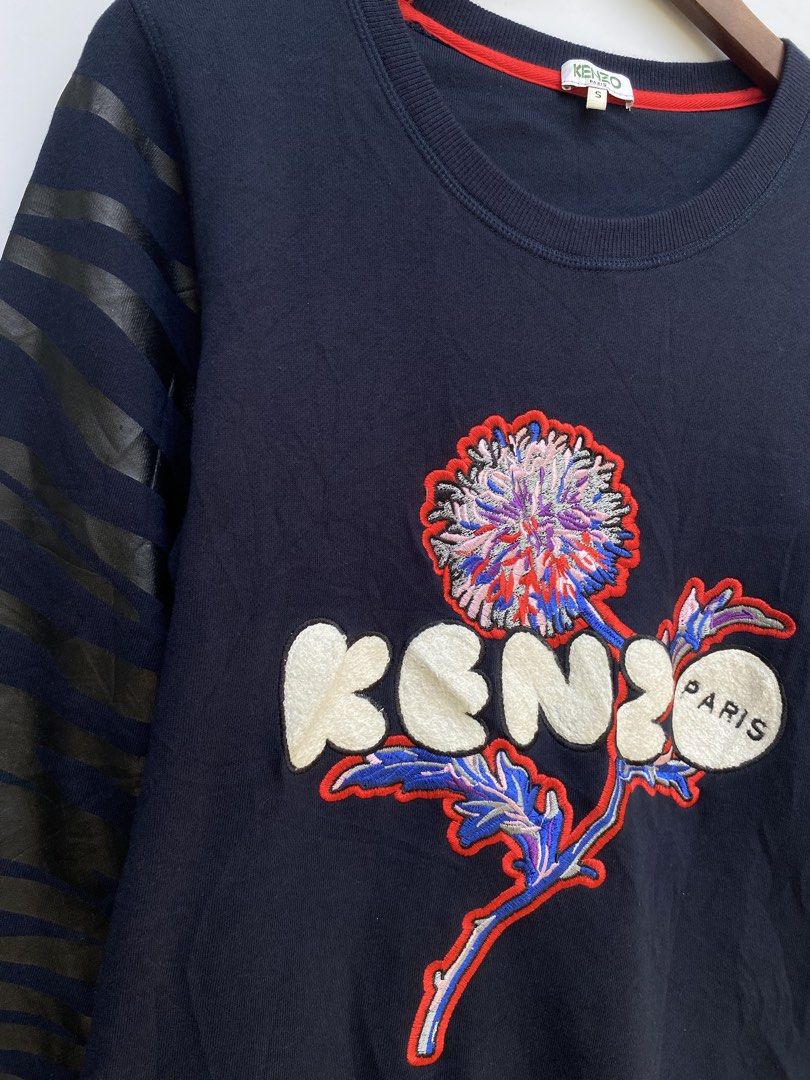 Kenzo Paris Embroidered Flower Sweatshirt (Category: Longsleeves) located in Manila. Submitted by deguertoje73072 (Listing ID 1464422394, Image 3). Description: - Navy blue Kenzo Paris sweatshirt - Size S - Large embroidered flower graphic with Kenzo Paris logo - Tiger stripe pattern on sleeves - Made in Morocco.