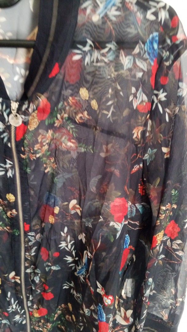 Kim Youngs Sheer Floral Bomber Jacket (Category: Coats, Jackets and Outerwear) located in Cebu City. Submitted by kangaroo78 (Listing ID 1464369100, Image 2). Description: - Sheer bomber jacket by Kim Youngs - Dark floral print with red roses and blue flowers - Zip-up front closure - Ribbed cuffs and hem - Lightweight and airy fabric - Ideal for layering over tops or dresses Location Dumlog Talisay City Cebu .
