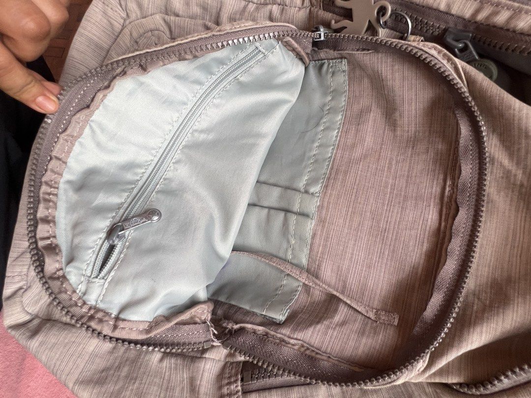 Kipling Backpakc Bag Beige (Category: Backpacks) located in Batangas. Submitted by alaisaampa7513 (Listing ID 1464569578, Image 3). Description: - Beige Kipling sling bag - Multiple pockets inside and out - Main compartment with zip closure - Front pocket with zip closure - Adjustable strap - Lightweight material - Ideal for everyday use.