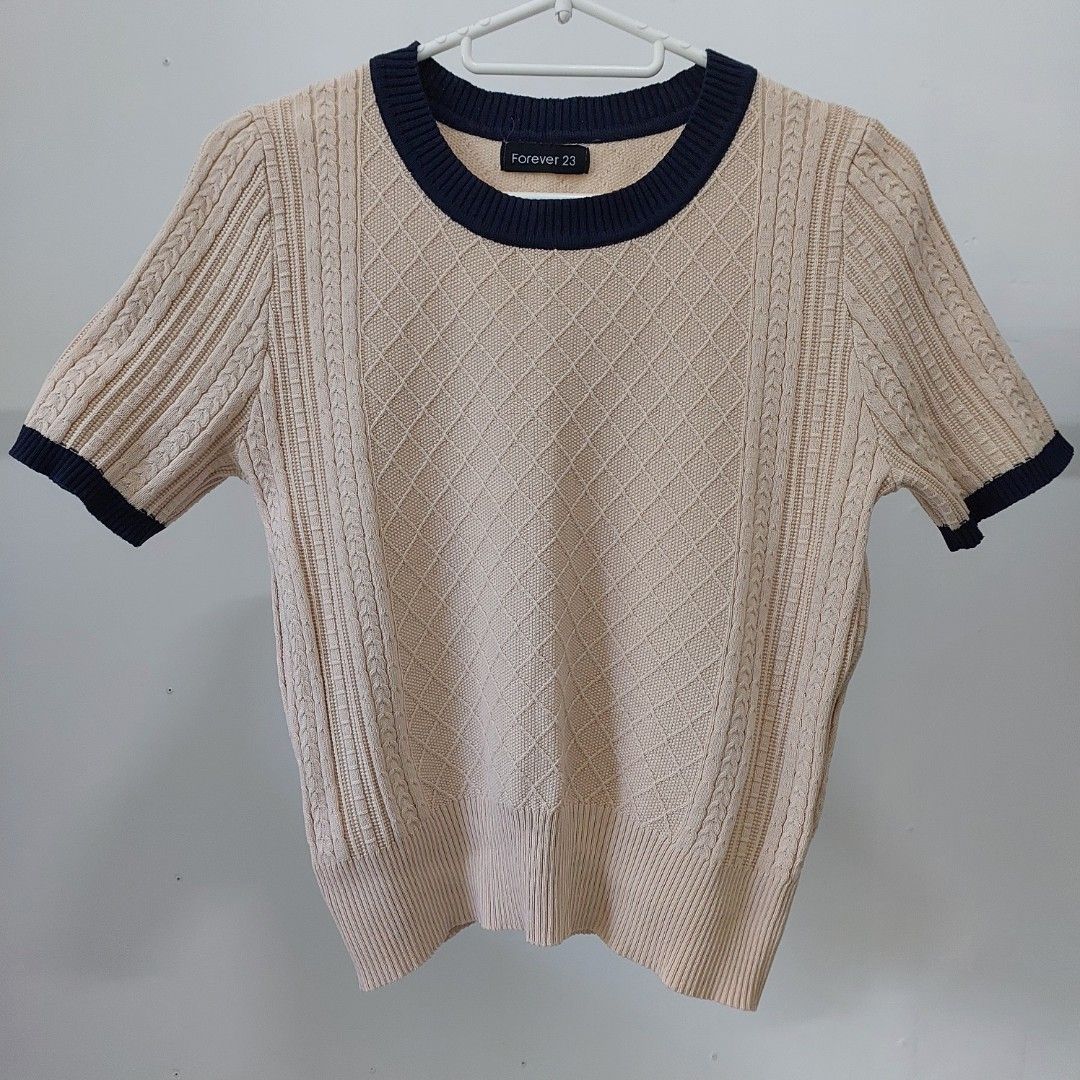 Knit top (Category: Blouses) located in Manila. Submitted by josta004 (Listing ID 1464425847, Image 1). Description: - beige knit top with navy trim -semi cropped RFS : decluttering .
