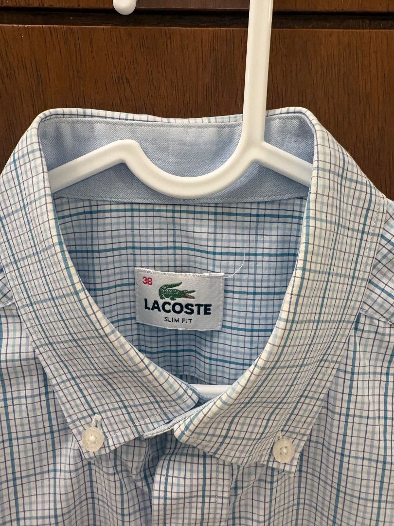 Lacoste Blue Check Short Sleeve Button-Down Shirt (Category: Tshirts & Polo Shirts ) located in Mandaluyong City. Submitted by jbor88 (Listing ID 1464367192, Image 2). Description: Brand: Lacoste Color: Light Blue & White Checkered Style: Short Sleeve Shirt Fit: Slim Fit Collar: Button Down Features: Iconic Lacoste Crocodile Logo on Chest Slim Fit 38 W=46cm L=71cm.