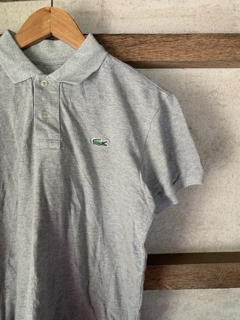 Lacoste Gray Polo Shirt (Category: Announcements) located in Cebu City. Submitted by team13ios (Listing ID 1464435497, Image 2). Description: Lacoste Polo W-18 L-22 Excellent condition Issue- cut tag NeedWash.