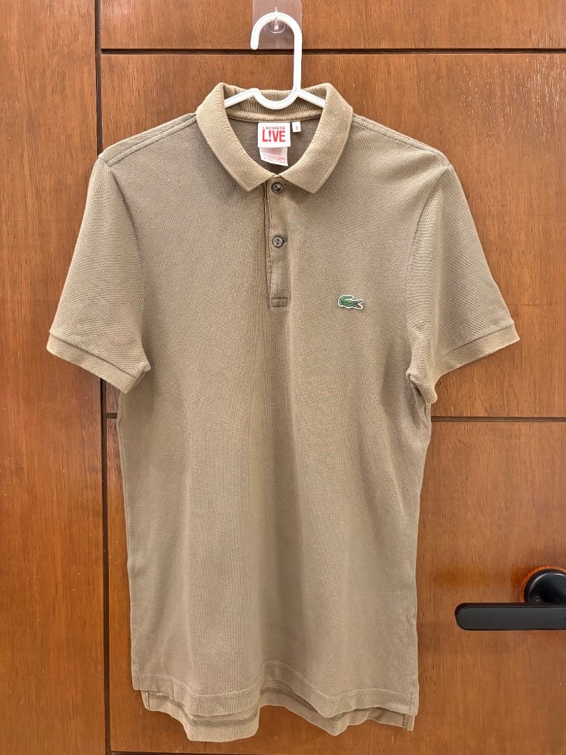 Lacoste L!VE Olive/Taupe Polo (Category: Tshirts & Polo Shirts ) located in Mandaluyong City. Submitted by jbor88 (Listing ID 1464364030, Image 1). Description: Lacoste L!VE Olive/Taupe Polo Size 2 W=45cm L=66cm with slight fade under collar (not seen when worn).
