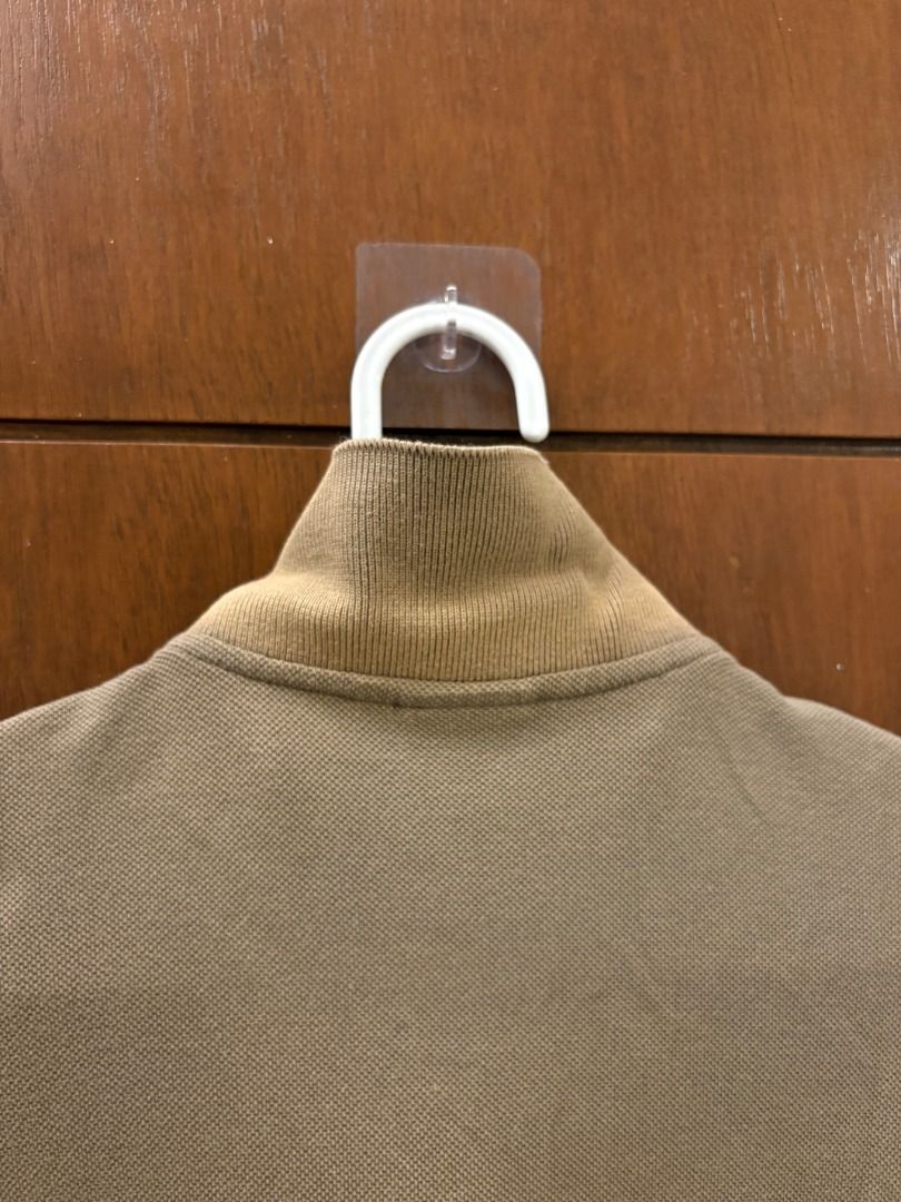 Lacoste L!VE Olive/Taupe Polo (Category: Tshirts & Polo Shirts ) located in Mandaluyong City. Submitted by jbor88 (Listing ID 1464364030, Image 3). Description: Lacoste L!VE Olive/Taupe Polo Size 2 W=45cm L=66cm with slight fade under collar (not seen when worn).