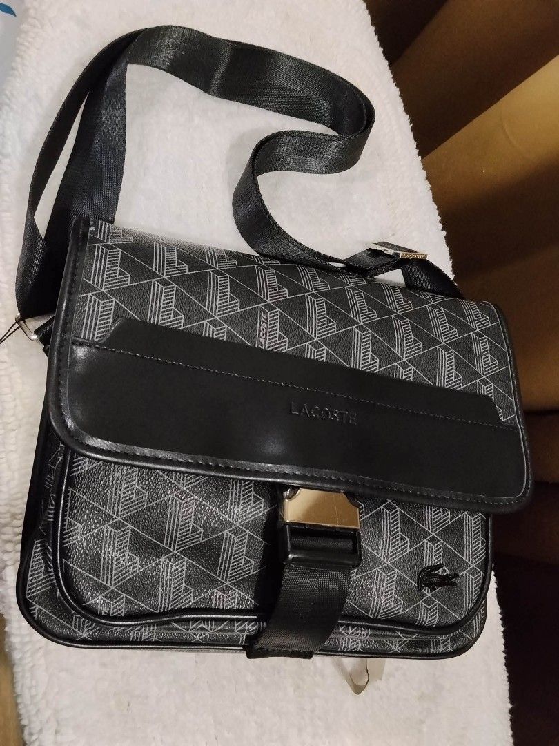 Lacoste Messenger Bag for Men (Category: Sling Bags) located in Las Pinas. Submitted by jellybeansbag (Listing ID 1464504891, Image 1). Description: - Brand new lacoste messenger bag - Crossbody bag style - Flap close - Monogram print - Ideal for travellers and on the go people - Unisex - No Bogus Buyers and Joy Reservers please. - Mode of Payment via GoTyme or Gcash.