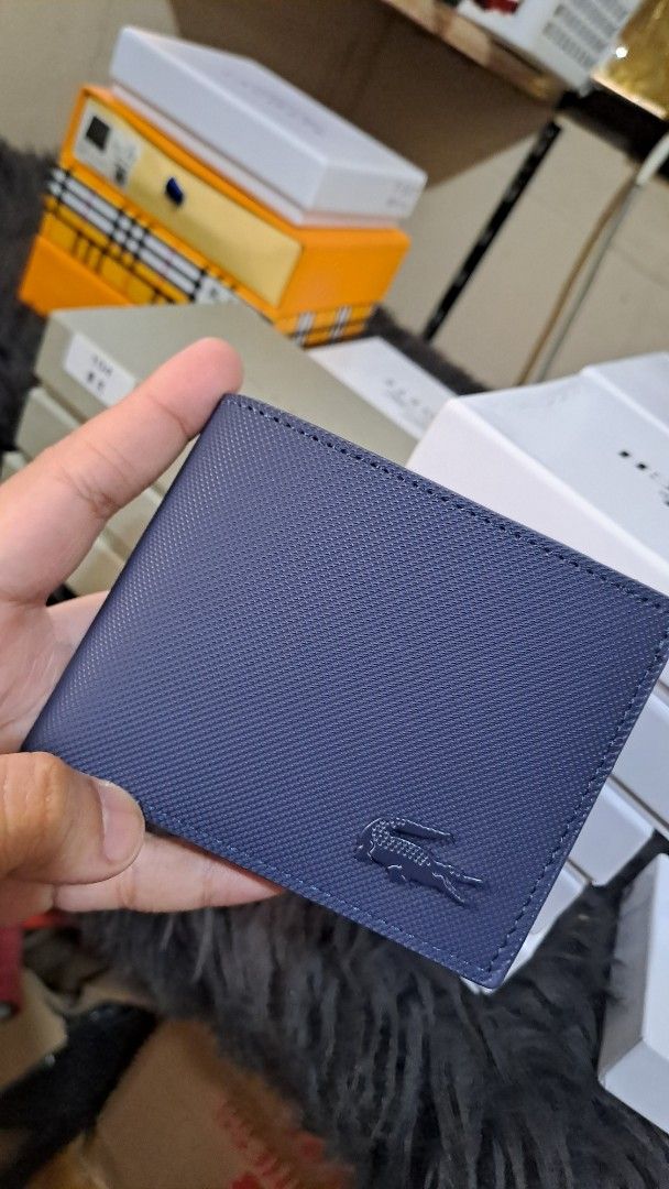 Lacoste Navy Blue wallet (Category: Luxury Bags & Wallets) located in Manila. Submitted by johnbooc.04 (Listing ID 1464495653, Image 1). Description: - Navy blue Lacoste cardholder - Genuine Saffiano leather - Iconic crocodile logo detail - Slim design for easy pocket storage - Perfect for organizing your cards.