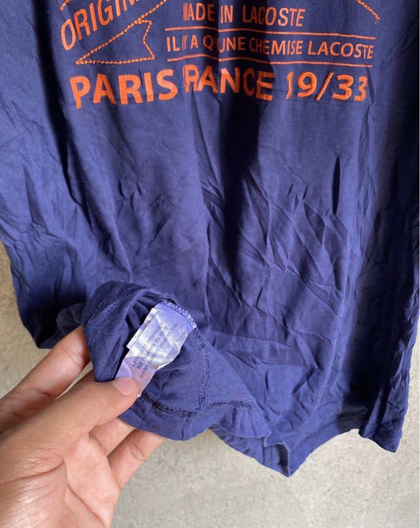 Lacoste Paris "Originale" T-Shirt (Category: Shirts) located in Dipolog. Submitted by wazienwathskin (Listing ID 1464383788, Image 3). Description: - Navy blue Lacoste t-shirt - Size 6 - Orange graphic print with "Paris Lacoste Originale" - "Made in Lacoste Paris France 19/33" detail - 100% Cotton - Made in France - Ideal for casual wear.