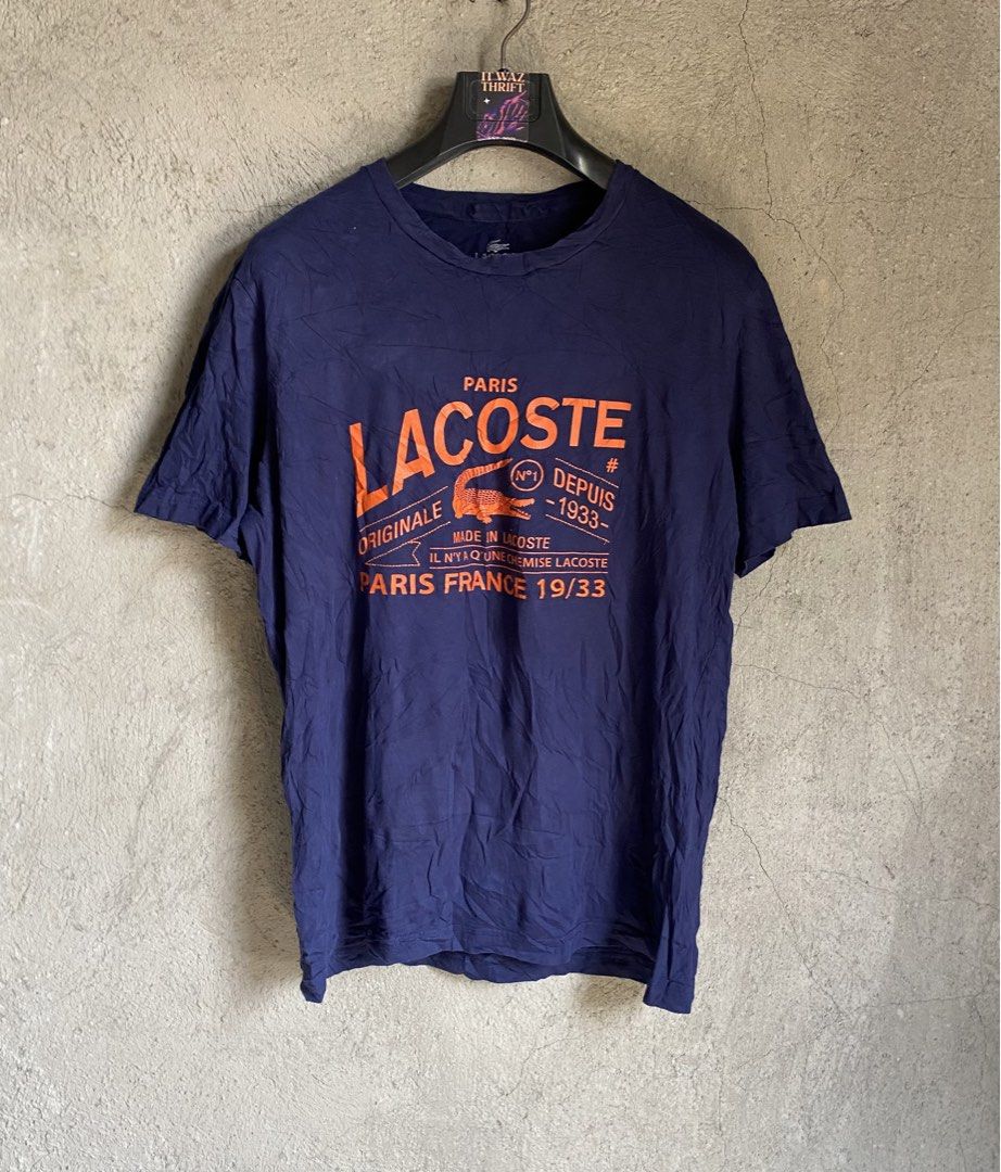 Lacoste Paris "Originale" T-Shirt (Category: Shirts) located in Dipolog. Submitted by wazienwathskin (Listing ID 1464383788, Image 1). Description: - Navy blue Lacoste t-shirt - Size 6 - Orange graphic print with "Paris Lacoste Originale" - "Made in Lacoste Paris France 19/33" detail - 100% Cotton - Made in France - Ideal for casual wear.
