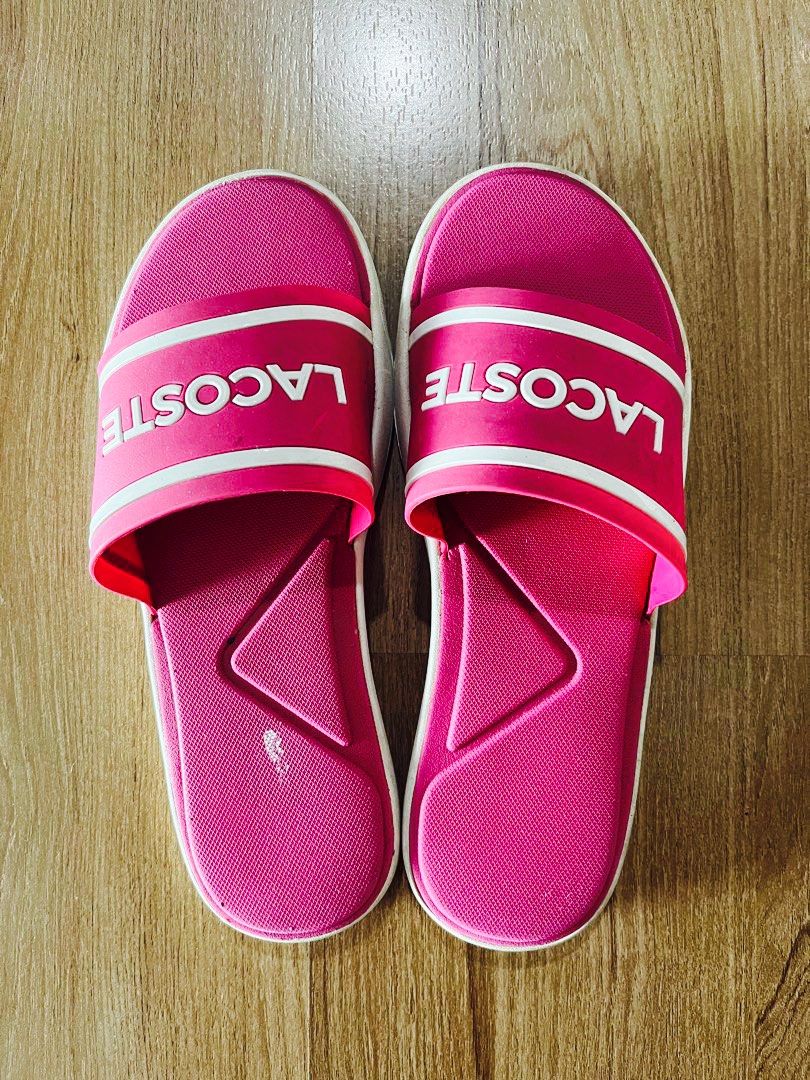 Lacoste Pink Slides / Slippers (Category: Slippers and slides) located in Manila. Submitted by r.ruth (Listing ID 1464374722, Image 1). Description: - Pink Lacoste slides - Fits 6 and 6.5 size - No defect. Just need cleaning. - RFS: Decluttering - 🚚 For same day delivery via Grab or Lalamove. Shipping Fee EXCLUDED..