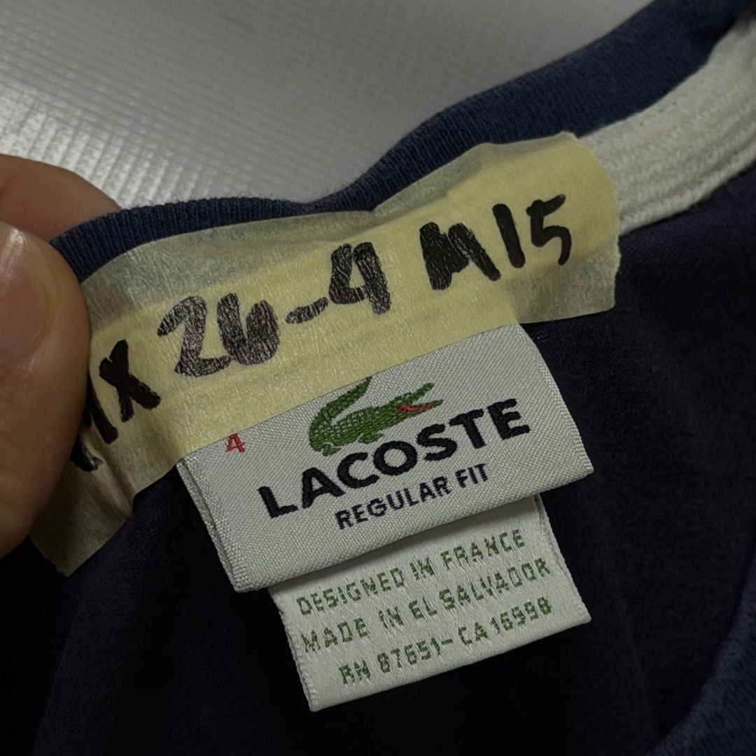 Lacoste Regular Fit Navy Blue T-Shirt (Category: Tshirts & Polo Shirts ) located in Manila. Submitted by johnedel_james (Listing ID 1464537996, Image 3). Description: - Navy blue Lacoste t-shirt - Regular fit - Designed in France, Made in El Salvador - Classic Lacoste crocodile logo printed on front - Tag has some writing - Perfect for casual wear.