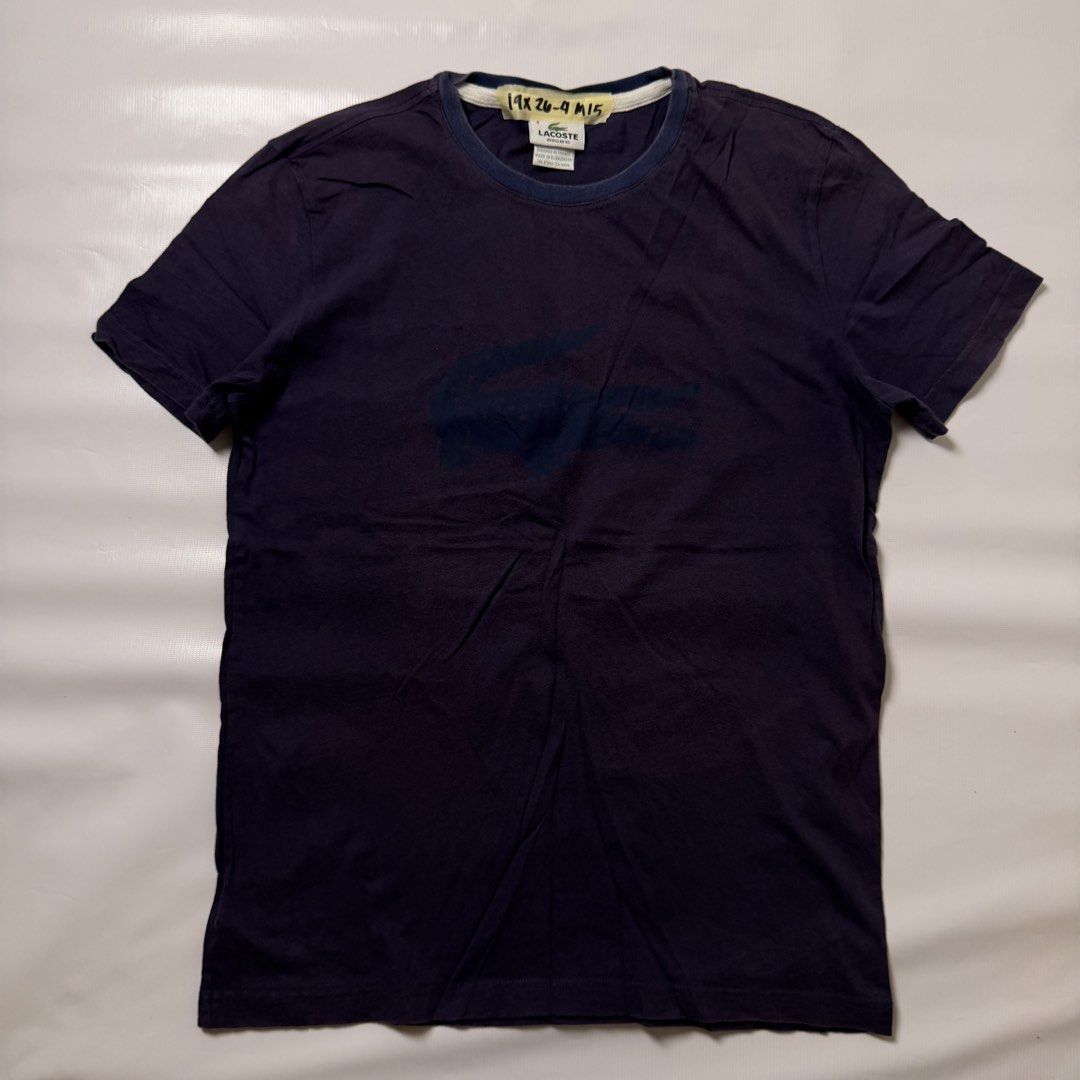 Lacoste Regular Fit Navy Blue T-Shirt (Category: Tshirts & Polo Shirts ) located in Manila. Submitted by johnedel_james (Listing ID 1464537996, Image 1). Description: - Navy blue Lacoste t-shirt - Regular fit - Designed in France, Made in El Salvador - Classic Lacoste crocodile logo printed on front - Tag has some writing - Perfect for casual wear.