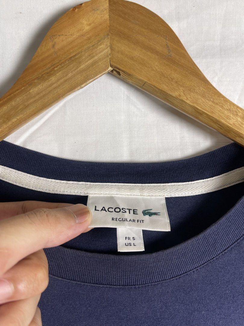 Lacoste Regular Fit T-shirt Navy Blue (Category: Tshirts & Polo Shirts ) located in Manila. Submitted by noahcastilljos363 (Listing ID 1464465296, Image 2). Description: - Navy blue Lacoste t-shirt - Classic script logo with 'Established 1927' detail - Size: US L / FR S - Fit: Regular - Origin: Made in Vietnam - A great staple piece for any wardrobe.