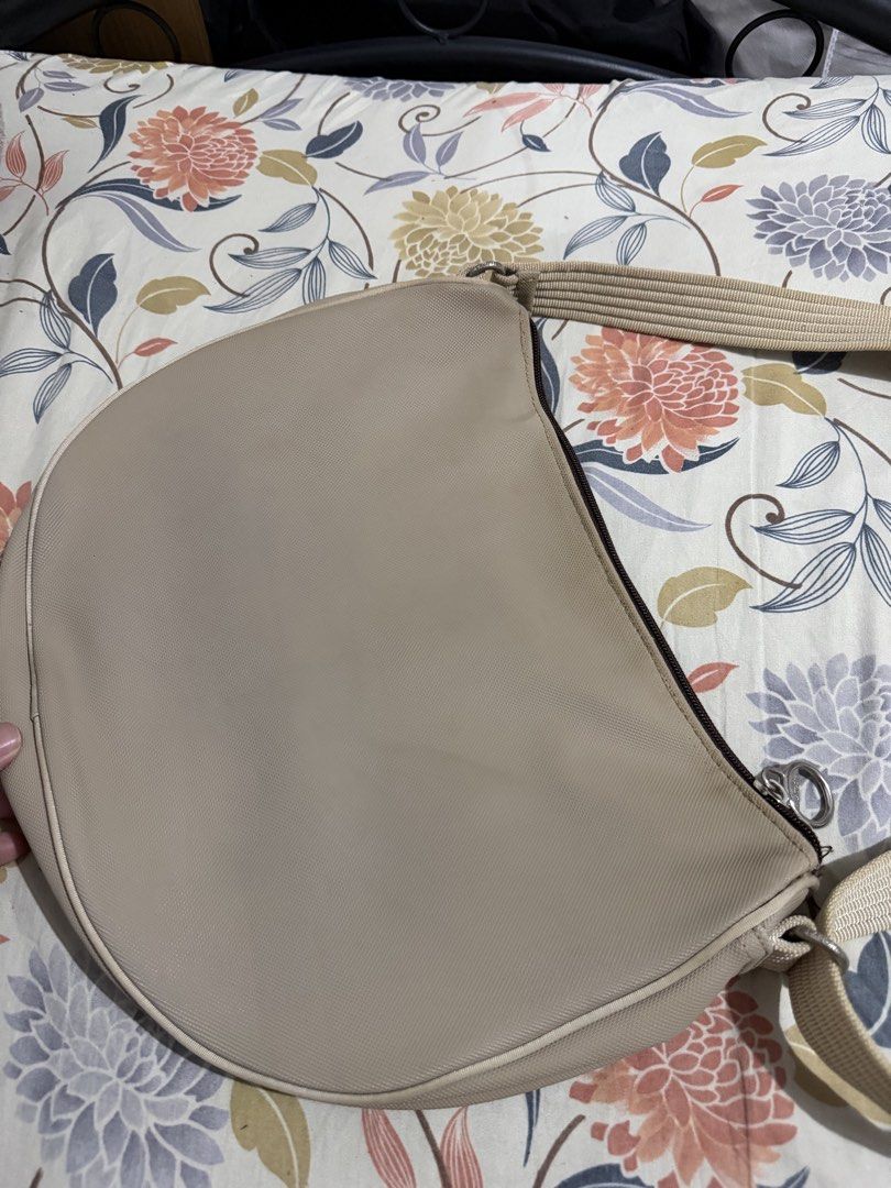 Lacoste Shoulder Bag (Category: Shoulder Bags) located in Quezon City. Submitted by yoooitschris (Listing ID 1464455021, Image 2). Description: Lacoste Shoulder bag Cream/beige color Heavily used. With some discolorations. Still in usable condition .