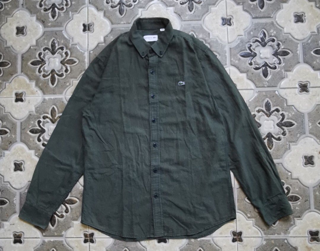 Lacoste Slim Fit Long Sleeve Button Down Shirt (Category: Formal Shirts) located in Davao. Submitted by dmp1993 (Listing ID 1464388628, Image 1). Description: Green Lacoste shirt with a subtle check pattern. Slim fit, long sleeves. Button-down collar. Small crocodile logo on the chest. Tag shows FR 40, US M. Made in Korea. Great for casual or smart casual wear..