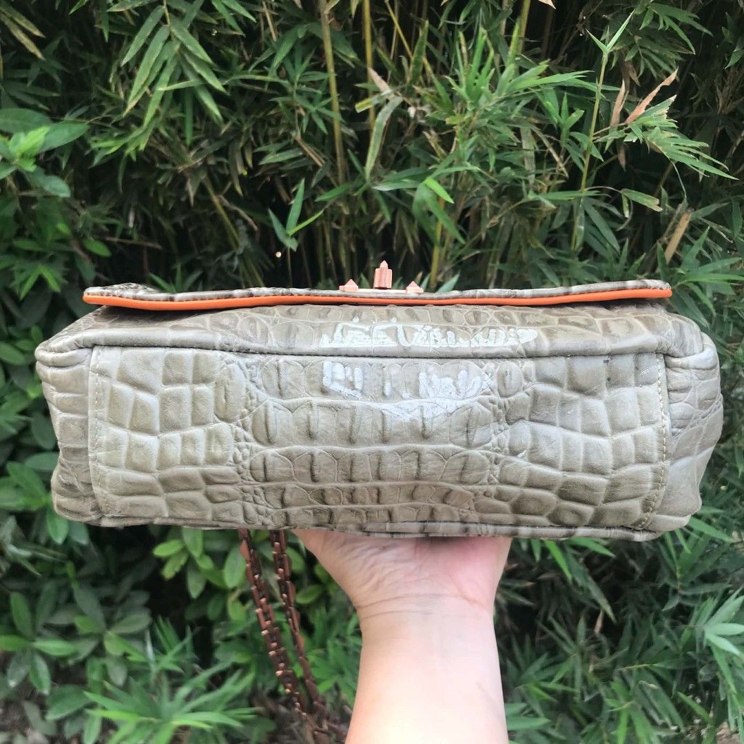 Lanvin Grey Crocodile Embossed Chain Shoulder Bag (Category: Cross-body Bags) located in Midsayap. Submitted by purse_gedo (Listing ID 1464437038, Image 3). Description: - Grey crocodile embossed shoulder bag - Striking orange interior - Unique rose gold chain strap - Distinctive clasp closure - Convenient back pocket - Approx. 10 inches wide x 6 inches tall - Adds a statement to any outfit.