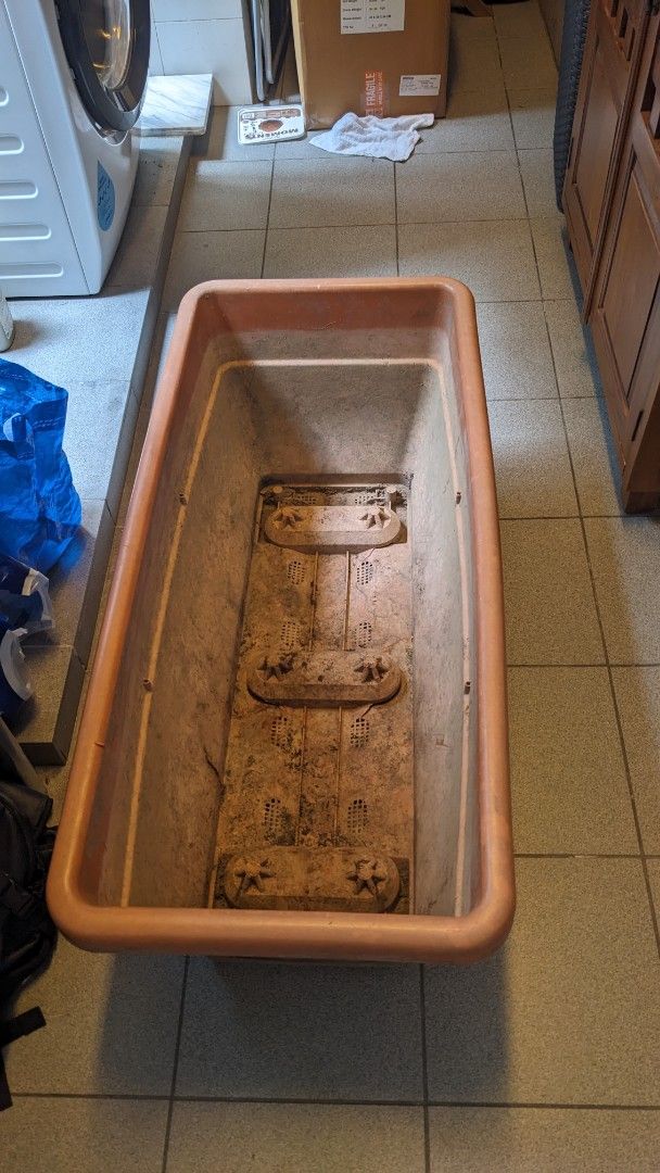 2 Large Rectangular Planter Box (Category: Pots & Planters) located in Singapore. Submitted by vdt2024 (Listing ID 1464364770, Image 1). Description: - Large rectangular planter box - Made of durable orange plastic - Features drainage holes and raised interior sections - Suitable for outdoor garden or patio use - Shows some signs of previous outdoor use (marks/dirt inside and on sides) 2 pieces available 45w x 98 L, 40cm high..