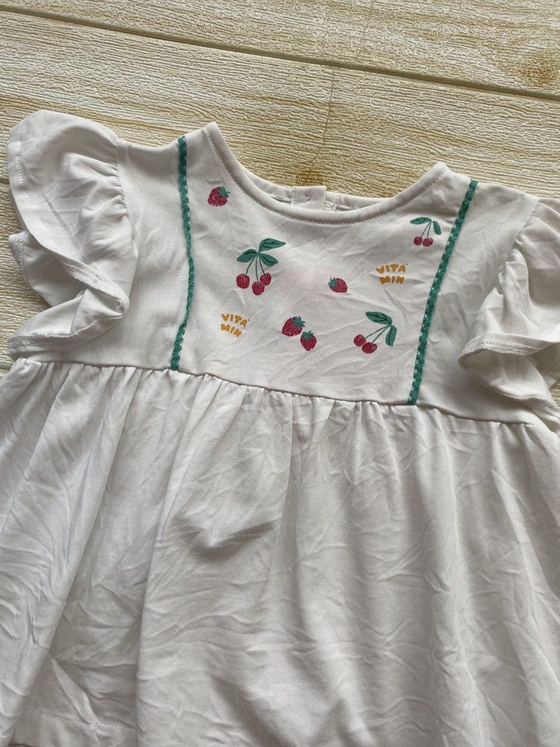 Laughing child cherry top (Category: Babies & Kids Fashion) located in Cebu City. Submitted by yjainani (Listing ID 1464372792, Image 2). Description: white toddler top features playful cherry and strawberry embroidery accented with green picot trim and flutter sleeves.