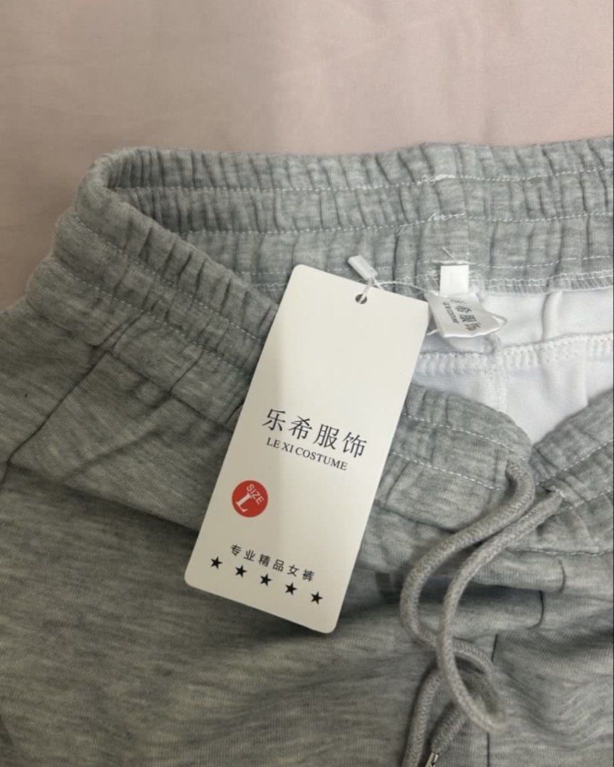 LE XI COSTUME Grey Flared Sweatpants Size L (Category: Activewear) located in Quezon City. Submitted by thingsdeclutter (Listing ID 1464440474, Image 3). Description: - Grey flared sweatpants from LE XI COSTUME - Elastic waistband with drawstring - Two side pockets - Comfortable and casual - Ideal for lounging or running errands - Size: L.