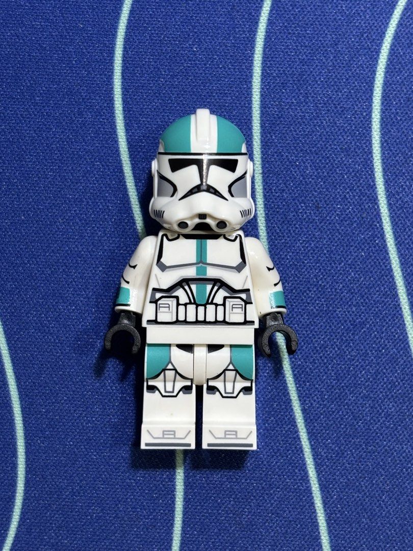 LEGO Star Wars GCC Captain Howzer Clone Trooper Minifigure (Category: Lego & Building Sets) located in Quezon City. Submitted by rickbrick (Listing ID 1464526675, Image 1). Description: - Pad-printed custom LEGO Star Wars Clone Trooper minifigure - Features detailed printing on helmet, torso, and legs - Distinctive teal stripe on the helmet - Black arms and hands - White legs with matching teal accents - Ideal addition for any Star Wars LEGO enth