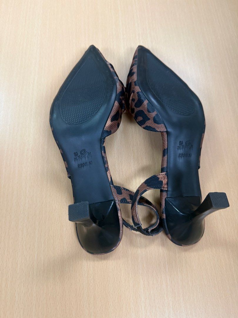 Leopard Print Slingback Heels with Bow Detail (Category: Heels) located in Quezon City. Submitted by lovedbymaxandmikoy (Listing ID 1464568144, Image 3). Description: - Chic leopard print slingback heels - Elegant pointed toe with a cute bow accent - Secure and comfortable elastic strap around the heel - Sturdy block heel for all-day wear - Size: 230 (Philippine size) / EU 36.5 - Perfect for adding a stylish touch to any outfit.