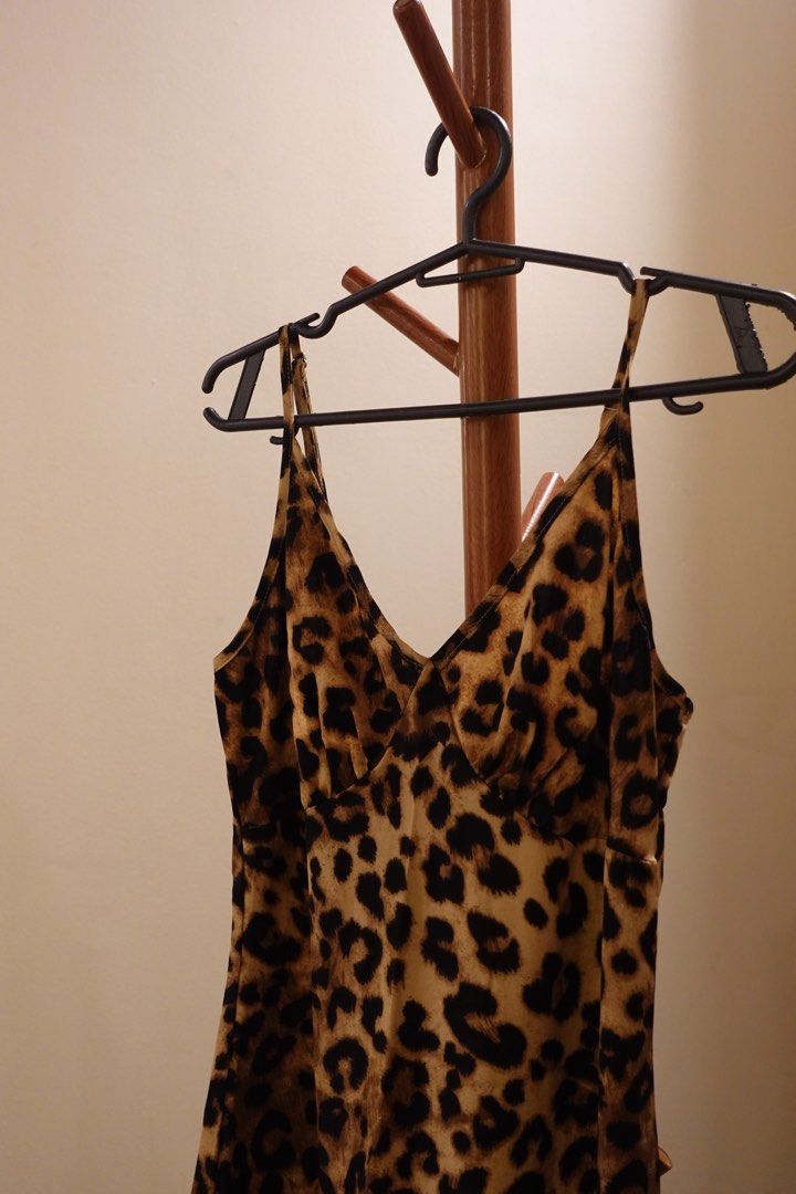 Leopard Print Slip Maxi Dress (Category: Dresses) located in Pasig City. Submitted by hulyascloset (Listing ID 1464544811, Image 2). Description: - Chic leopard print slip dress - Maxi length - Delicate spaghetti straps - Flattering V-neckline - Convenient back zipper closure - Versatile for night outs or casual days - Easily styled with heels or sneakers.