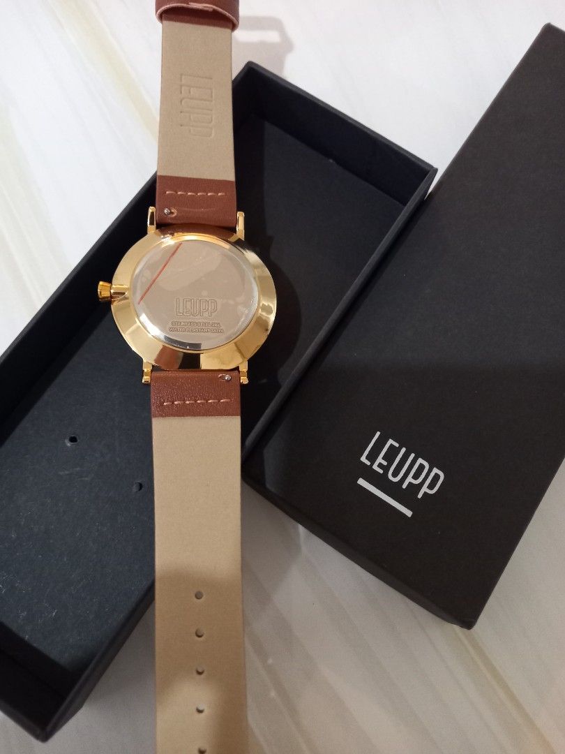 LEUPP Gold Watch with Brown Leather Strap (Category: Women's Watches) located in Paranaque City. Submitted by janmar02 (Listing ID 1464424306, Image 3). Description: - LEUPP Watch. Never used. Just fit. -RFS - Too big for my wrist. This is unisex but I have a slim arm and wrist that it looked too big for me. -Still with box - Elegant gold casing - Deep dark blue watch face - Comfortable brown leather strap - Simple and classic design - Ideal for 