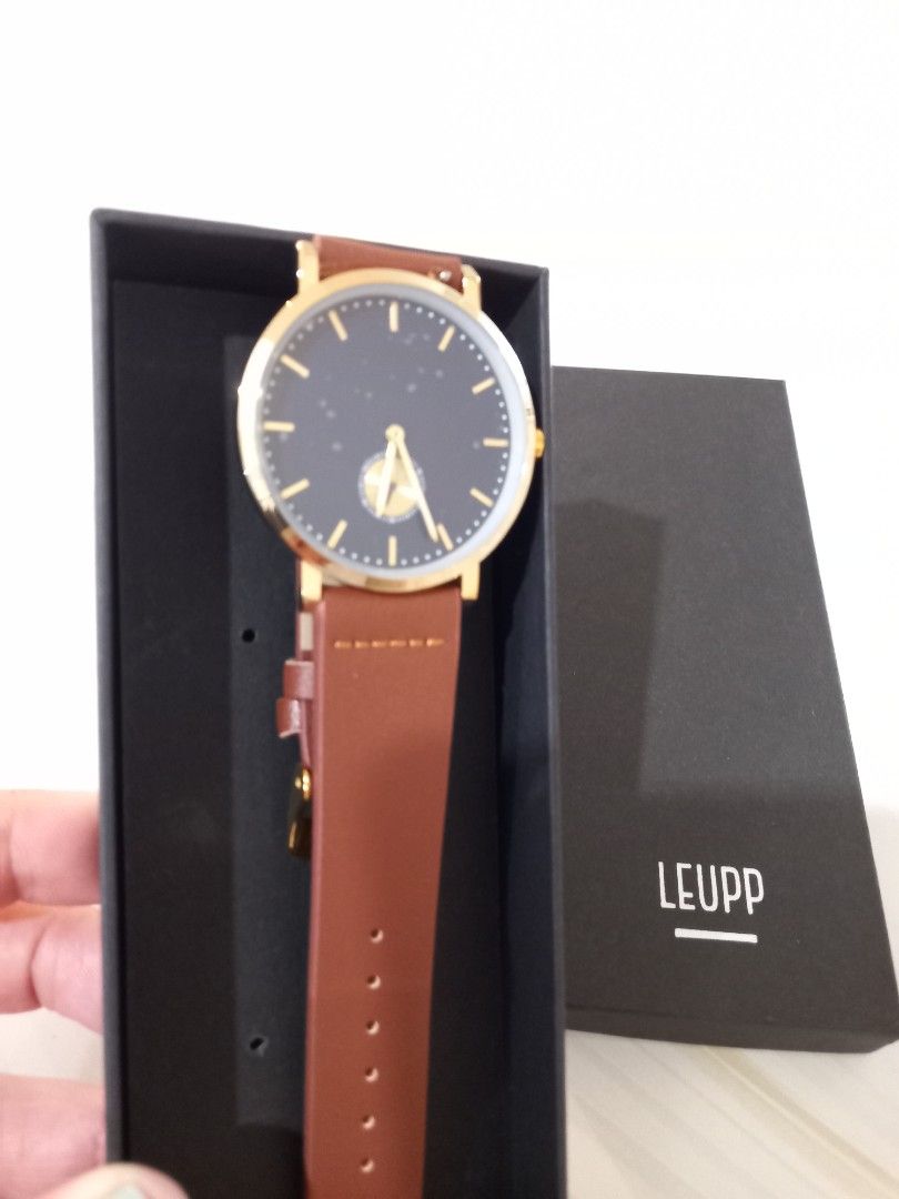 LEUPP Gold Watch with Brown Leather Strap (Category: Women's Watches) located in Paranaque City. Submitted by janmar02 (Listing ID 1464424306, Image 1). Description: - LEUPP Watch. Never used. Just fit. -RFS - Too big for my wrist. This is unisex but I have a slim arm and wrist that it looked too big for me. -Still with box - Elegant gold casing - Deep dark blue watch face - Comfortable brown leather strap - Simple and classic design - Ideal for 