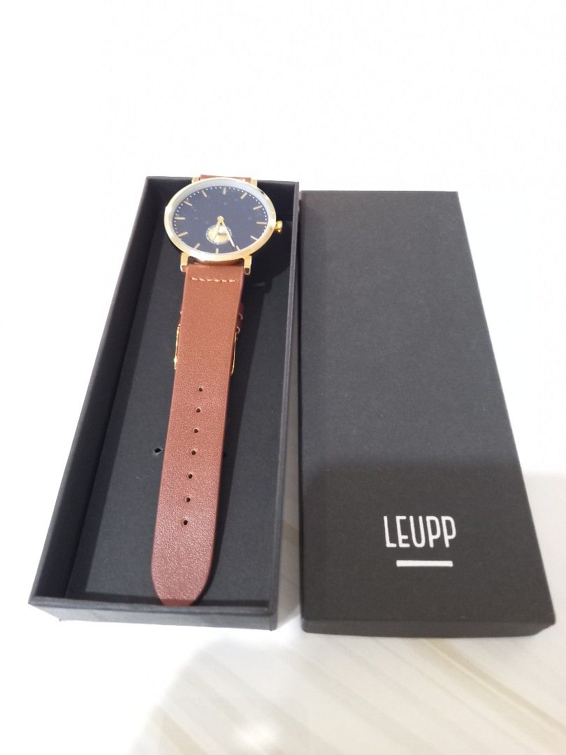 LEUPP Gold Watch with Brown Leather Strap (Category: Women's Watches) located in Paranaque City. Submitted by janmar02 (Listing ID 1464424306, Image 2). Description: - LEUPP Watch. Never used. Just fit. -RFS - Too big for my wrist. This is unisex but I have a slim arm and wrist that it looked too big for me. -Still with box - Elegant gold casing - Deep dark blue watch face - Comfortable brown leather strap - Simple and classic design - Ideal for 