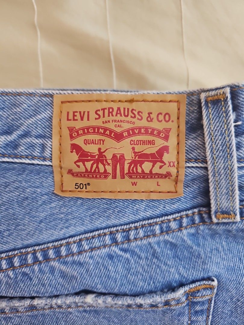 Levi's 501 Original Fit Jeans - Medium Wash (Category: Jeans) located in Muntinlupa City. Submitted by shoptitak (Listing ID 1464387650, Image 3). Description: - Classic Levi's 501 jeans - Medium blue wash denim - Button fly closure - Iconic five-pocket styling - Made in Cambodia - Essential wardrobe staple.