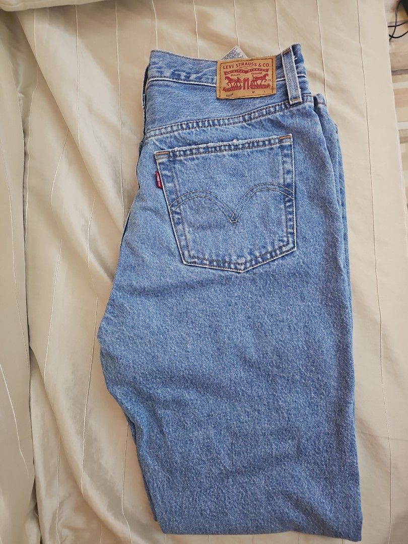 Levi's 501 Original Fit Jeans - Medium Wash (Category: Jeans) located in Muntinlupa City. Submitted by shoptitak (Listing ID 1464387650, Image 2). Description: - Classic Levi's 501 jeans - Medium blue wash denim - Button fly closure - Iconic five-pocket styling - Made in Cambodia - Essential wardrobe staple.